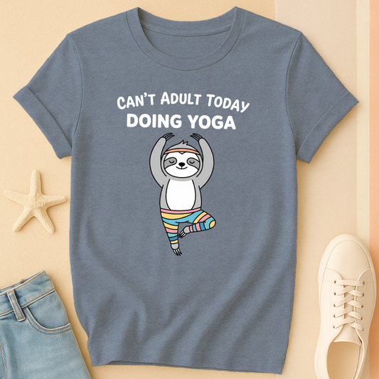 Blue t-shirt with a sloth doing yoga graphic and text on a beige background