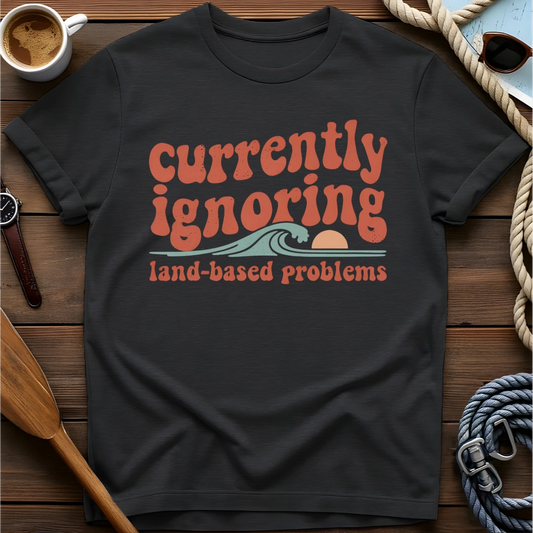 T-shirt with a retro scene of a person relaxing in a boat and text reading 'Those Sound Like Land Problems.'