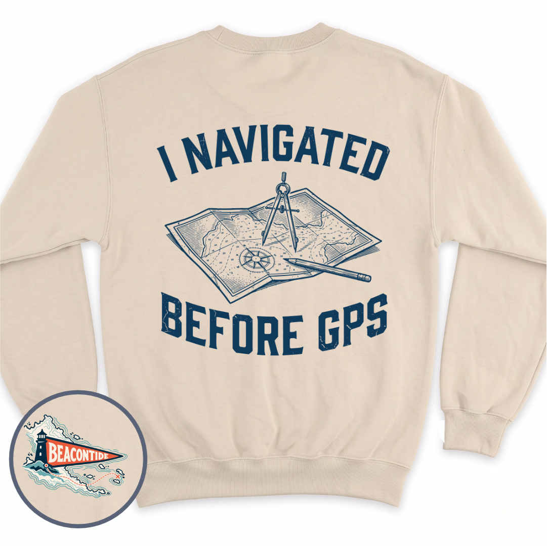 I Navigated Before GPS crewneck sweatshirt in Sand, back view — paper chart, dividers and pencil, BeaconTide