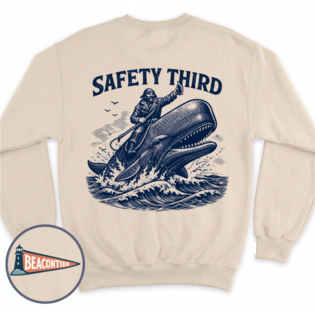 Safety Third crewneck sweatshirt in Sand, back view — man riding a whale with a thumbs up, BeaconTide