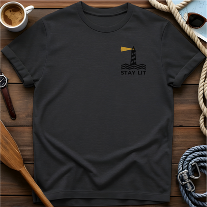 T-shirt with a lighthouse and waves above the words "Stay Lit."