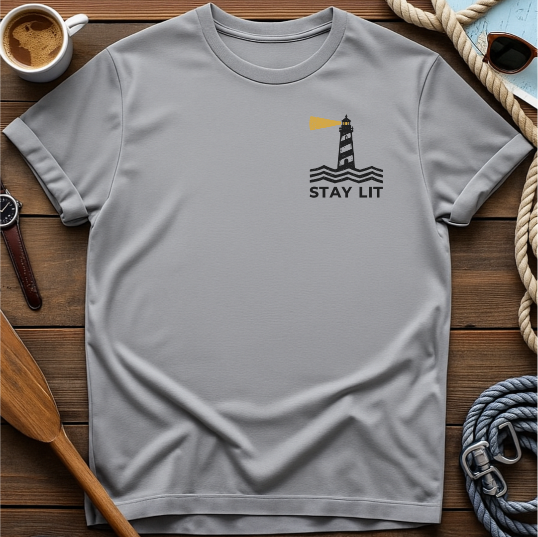 T-shirt with a lighthouse and waves above the words "Stay Lit."