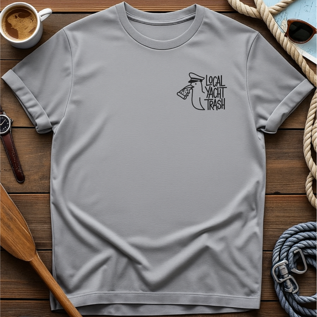 T-shirt with a line-drawn seagull in a captain's hat eating pizza, beside the words "Local Yacht Trash."