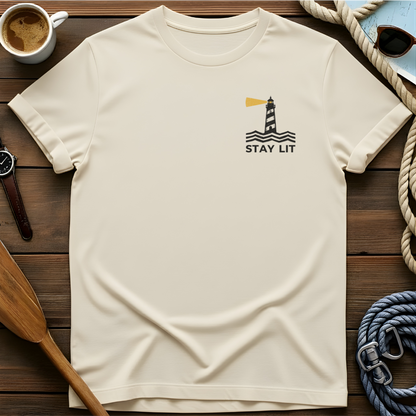 T-shirt with a lighthouse and waves above the words "Stay Lit."