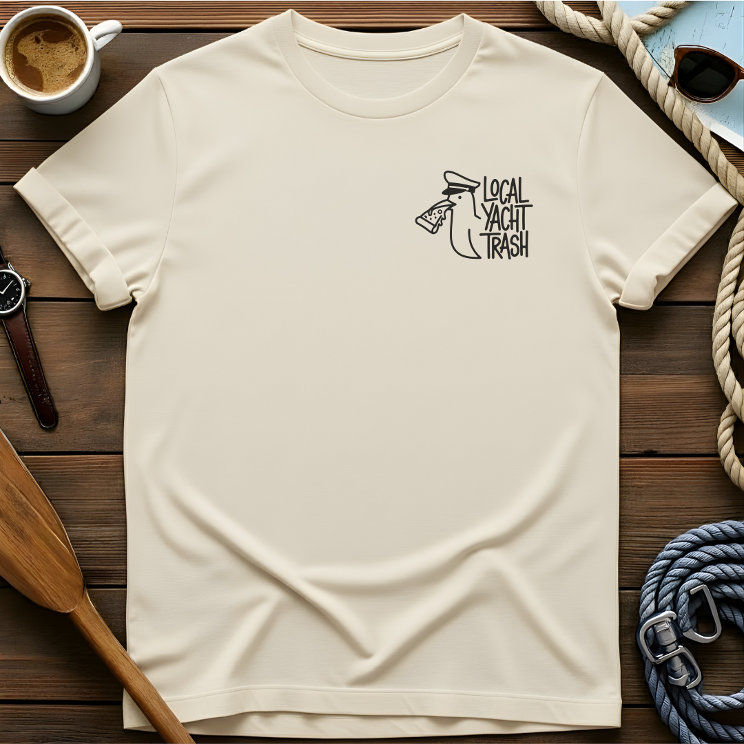 T-shirt with a line-drawn seagull in a captain's hat eating pizza, beside the words "Local Yacht Trash."