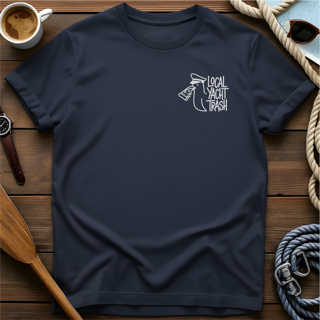 T-shirt with a line-drawn seagull in a captain's hat eating pizza, beside the words "Local Yacht Trash."
