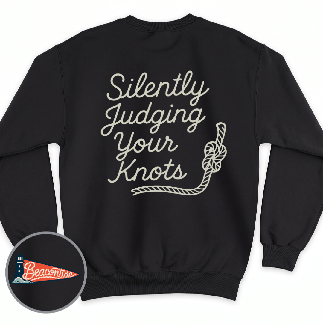 Silently Judging Knots crewneck sweatshirt in Black, back view — script lettering Silently Judging Your Knots with a knotted rope, BeaconTide