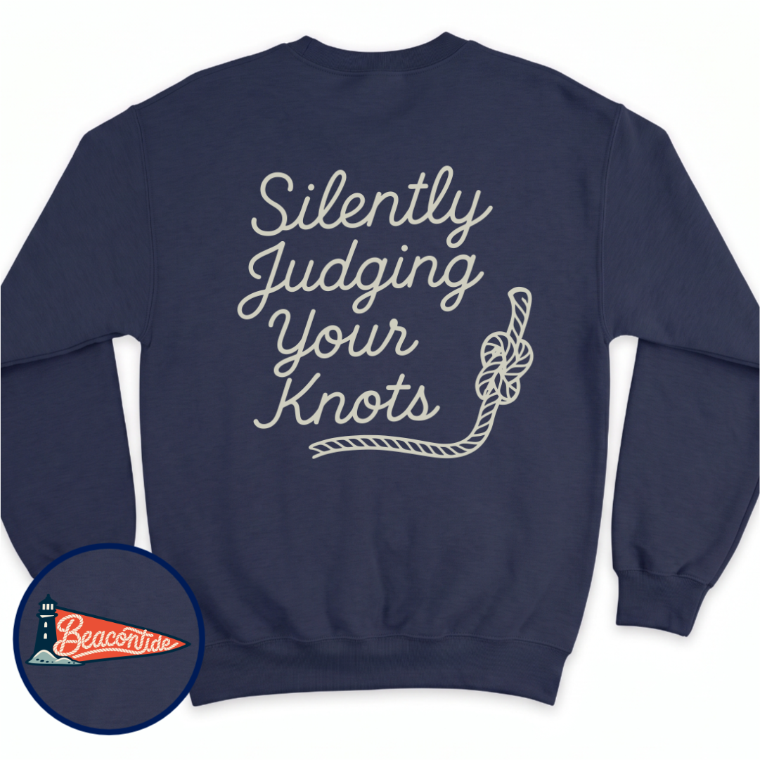 Silently Judging Knots crewneck sweatshirt in Navy, back view — script lettering Silently Judging Your Knots with a knotted rope, BeaconTide