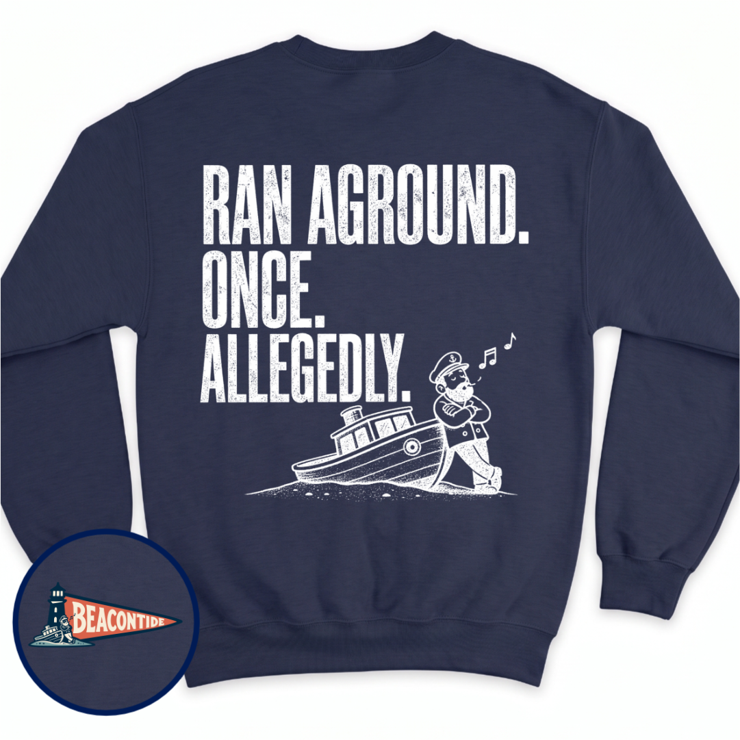 Allegedly Ran Aground crewneck sweatshirt in Navy, back view — Ran Aground. Once. Allegedly. with a captain leaning on a grounded boat, BeaconTide