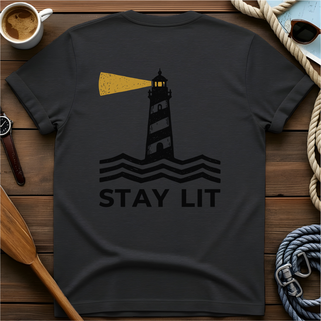 T-shirt with a lighthouse and waves above the words "Stay Lit."