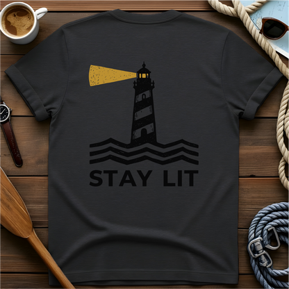 T-shirt with a lighthouse and waves above the words "Stay Lit."