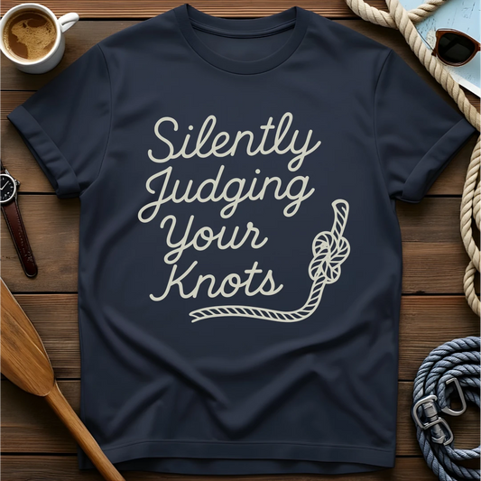 T-shirt with script text and a rope reading "Silently Judging Your Knots."